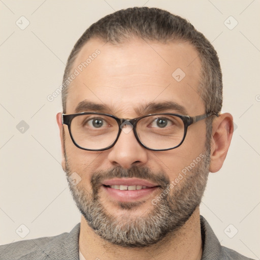 Joyful white adult male with short  black hair and brown eyes