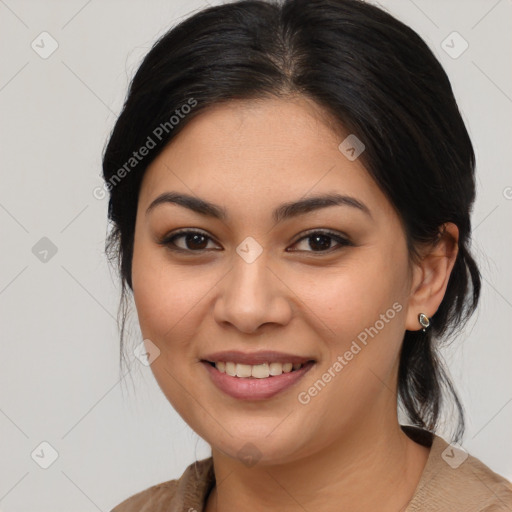 Joyful latino young-adult female with medium  brown hair and brown eyes