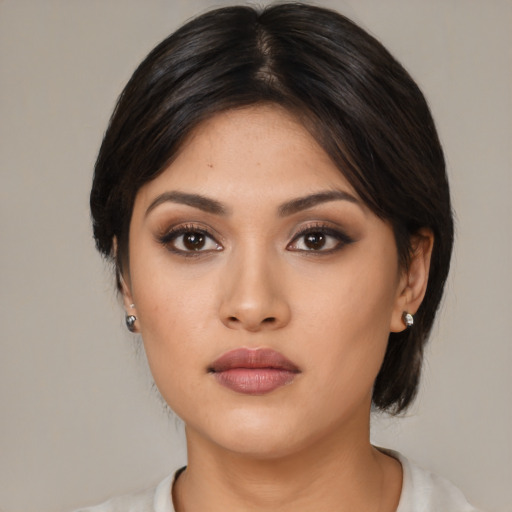 Neutral asian young-adult female with medium  black hair and brown eyes
