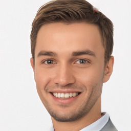 Joyful white young-adult male with short  brown hair and brown eyes