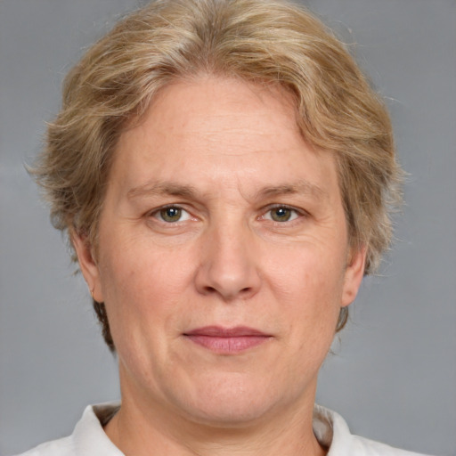 Joyful white adult male with medium  brown hair and blue eyes