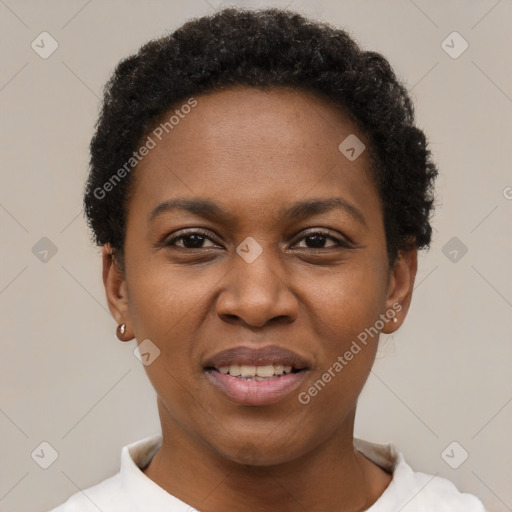 Joyful black adult female with short  black hair and brown eyes