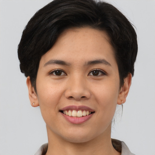 Joyful white young-adult female with short  brown hair and brown eyes