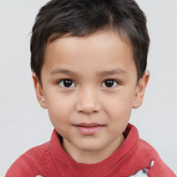 Joyful white child male with short  brown hair and brown eyes