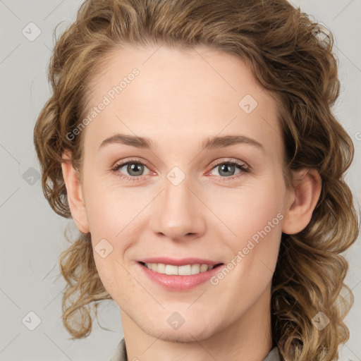 Joyful white young-adult female with medium  brown hair and green eyes