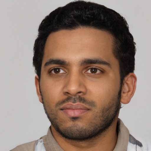 Neutral latino young-adult male with short  black hair and brown eyes