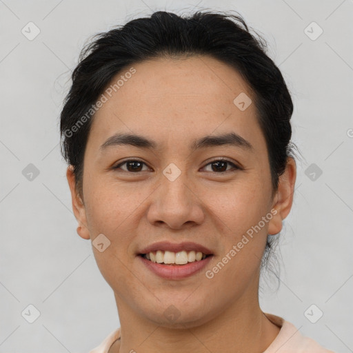 Joyful asian young-adult female with short  brown hair and brown eyes