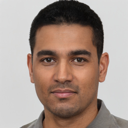 Neutral latino young-adult male with short  black hair and brown eyes
