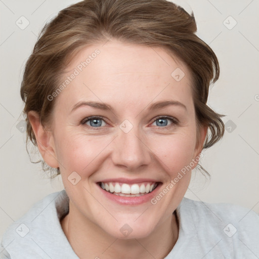 Joyful white young-adult female with medium  brown hair and blue eyes