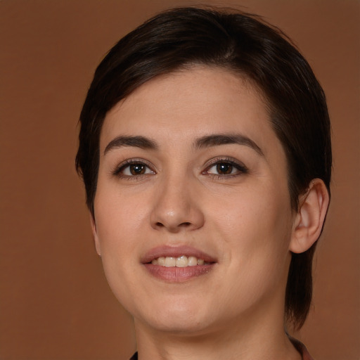 Joyful white young-adult female with medium  brown hair and brown eyes