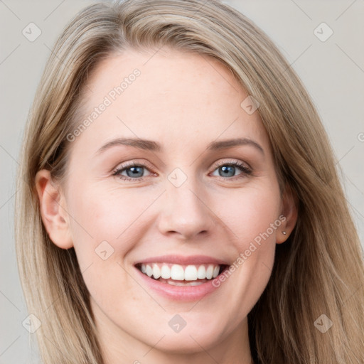 Joyful white young-adult female with long  brown hair and grey eyes