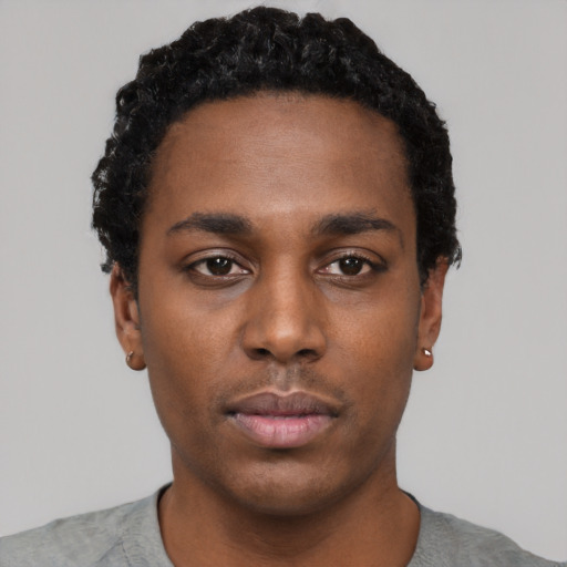 Neutral black young-adult male with short  black hair and brown eyes