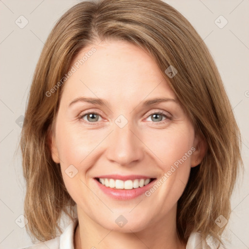 Joyful white young-adult female with medium  brown hair and green eyes