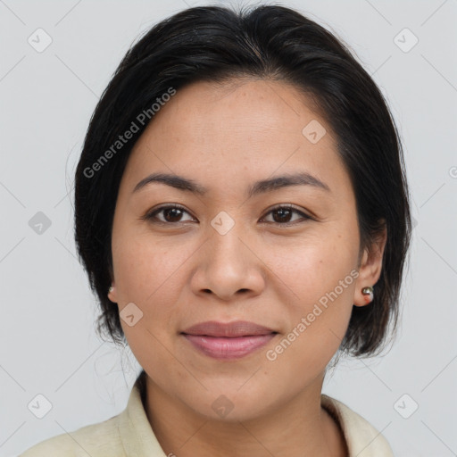 Joyful latino young-adult female with medium  brown hair and brown eyes