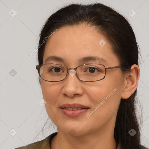 Joyful white adult female with long  brown hair and brown eyes