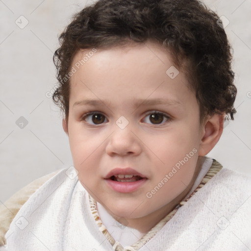 Joyful white child male with short  brown hair and brown eyes