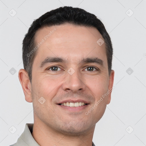 Joyful white young-adult male with short  brown hair and brown eyes