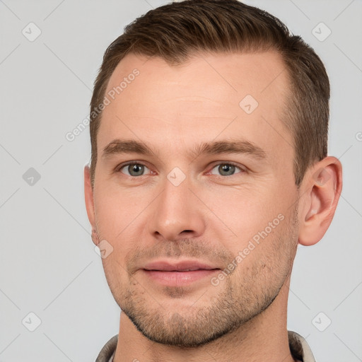 Joyful white young-adult male with short  brown hair and brown eyes