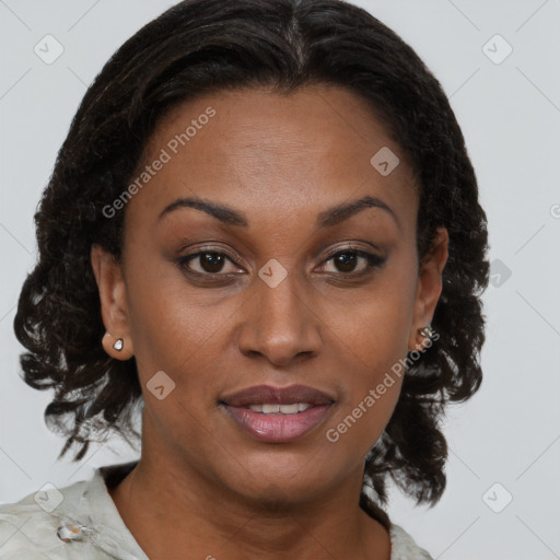 Joyful black adult female with medium  brown hair and brown eyes