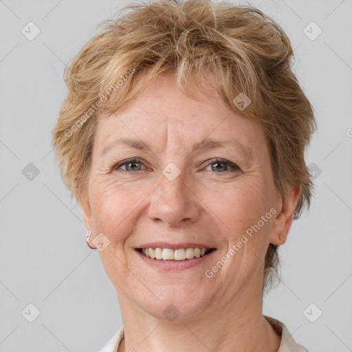 Joyful white adult female with short  brown hair and brown eyes