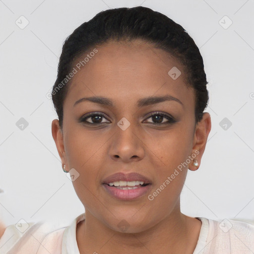 Joyful black young-adult female with short  black hair and brown eyes