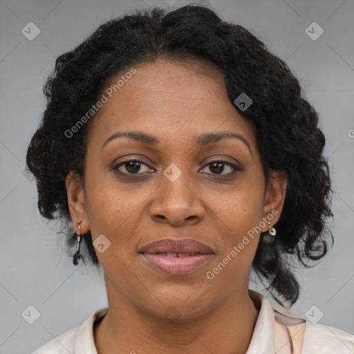 Joyful black adult female with medium  brown hair and brown eyes