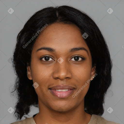 Joyful black young-adult female with medium  black hair and brown eyes