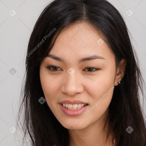 Joyful asian young-adult female with long  brown hair and brown eyes