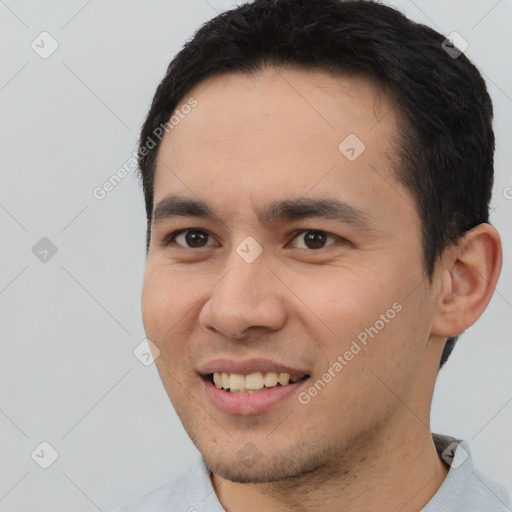 Joyful white young-adult male with short  black hair and brown eyes