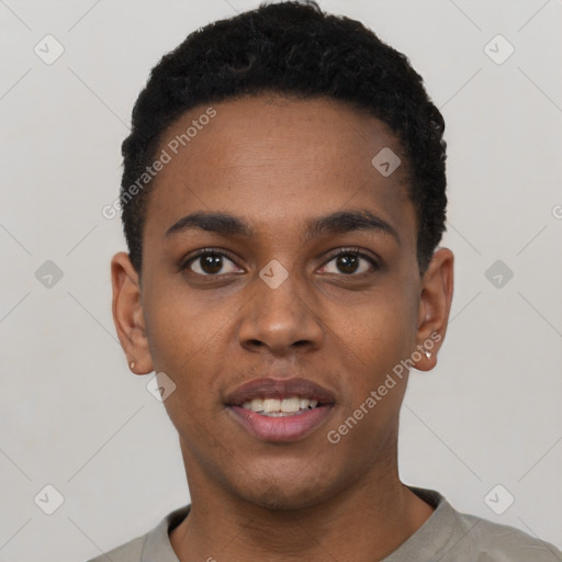 Joyful black young-adult male with short  black hair and brown eyes