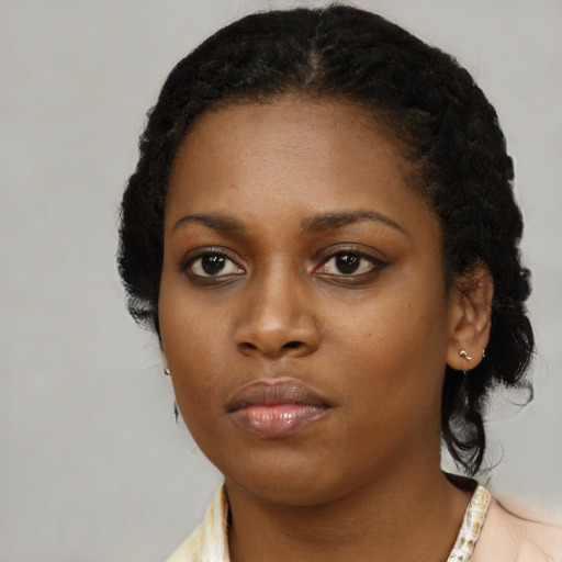 Neutral black young-adult female with medium  black hair and brown eyes