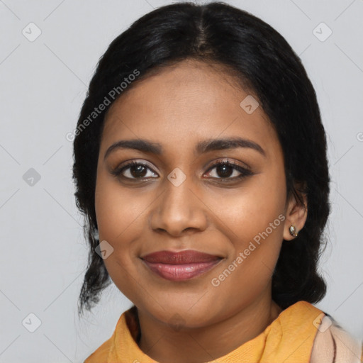 Joyful black young-adult female with medium  black hair and brown eyes