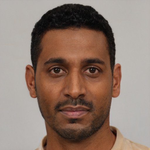 Neutral black young-adult male with short  black hair and brown eyes