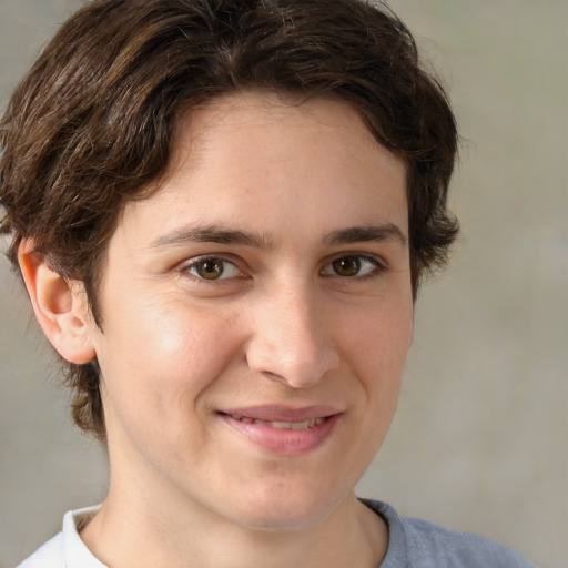 Joyful white young-adult male with medium  brown hair and brown eyes