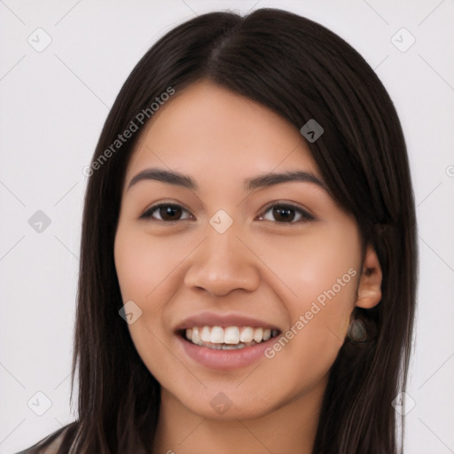 Joyful latino young-adult female with long  black hair and brown eyes