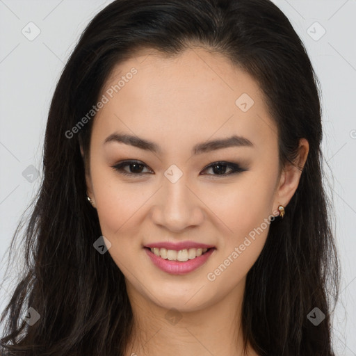 Joyful asian young-adult female with long  brown hair and brown eyes