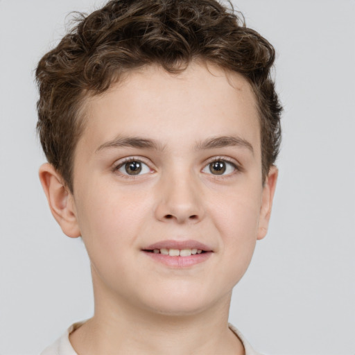 Joyful white child male with short  brown hair and brown eyes