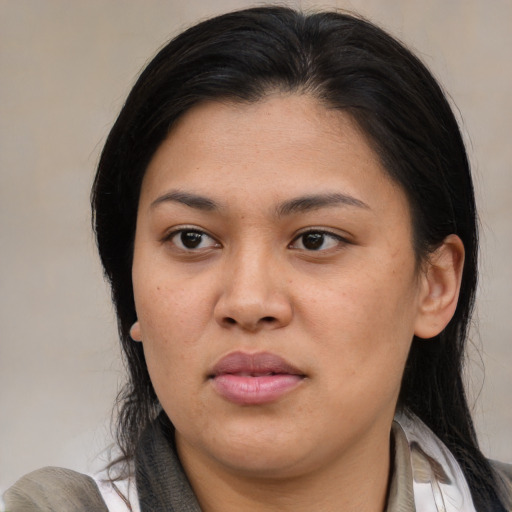 Joyful asian young-adult female with medium  brown hair and brown eyes