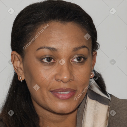 Joyful black young-adult female with long  brown hair and brown eyes