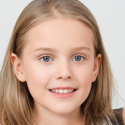 Joyful white child female with long  brown hair and grey eyes