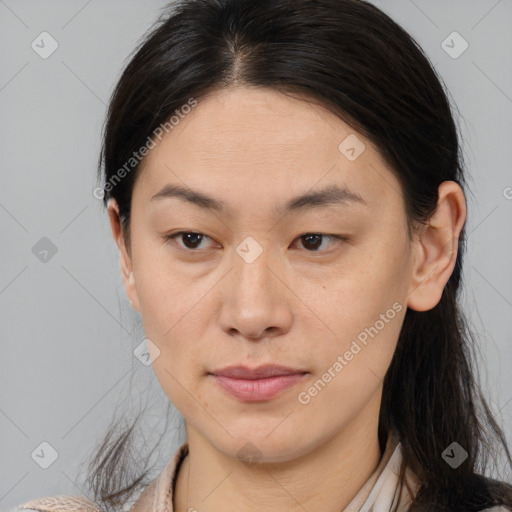 Joyful asian young-adult female with medium  brown hair and brown eyes