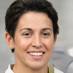 Joyful white adult female with short  brown hair and brown eyes