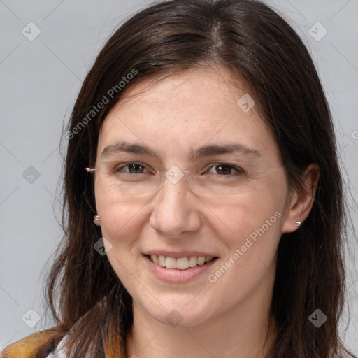 Joyful white adult female with long  brown hair and brown eyes