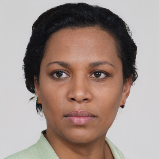 Neutral black young-adult female with short  brown hair and brown eyes