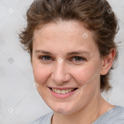 Joyful white young-adult female with medium  brown hair and blue eyes