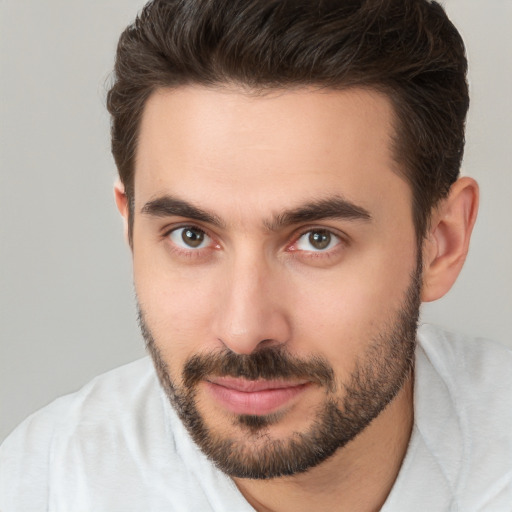 Joyful white young-adult male with short  brown hair and brown eyes