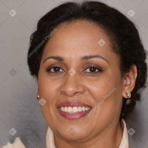 Joyful latino adult female with medium  brown hair and brown eyes