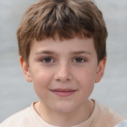 Joyful white child male with short  brown hair and brown eyes