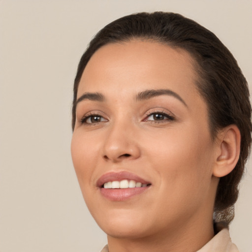 Joyful white young-adult female with medium  brown hair and brown eyes