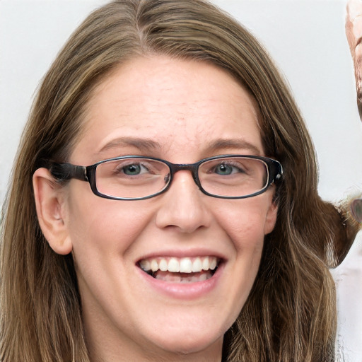 Joyful white adult female with long  brown hair and blue eyes